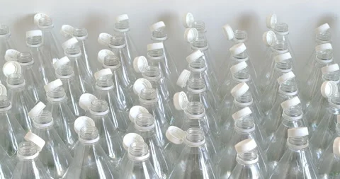 Many empty PET bottles with stationary plastic caps. Stock Footage 327454843
