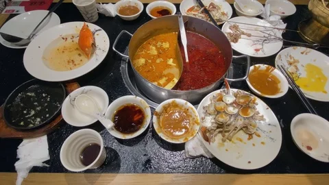 Many empty plates left after hot pot dinner Stock Footage 123610501