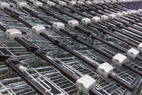 Many empty shopping carts in a row. Stock Photos