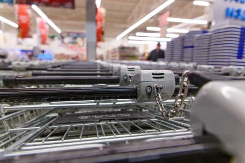 Many empty shopping carts in a row. Stock Photos