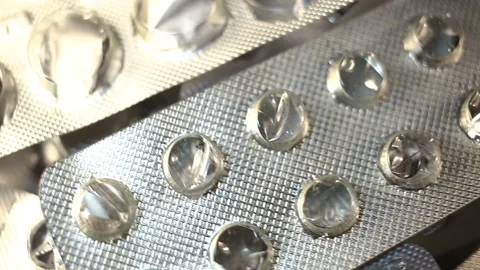 Many empty used cold-formed aluminium blisters (PVC aluminium foil blister pack) Stock Footage 145374429