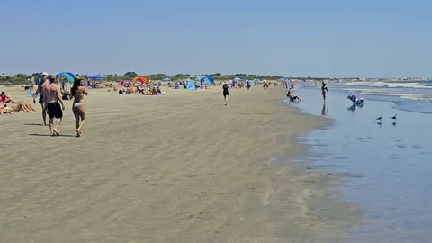 Many enjoy warm spring day at Sullivan Beach, SC Stock Footage 335238535