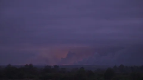 Many explosions with huge amount of smoke in the field far away Stock Footage 97051809