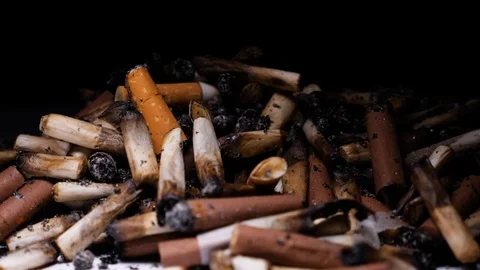 Many of extinguished cigarette butts of varying brands Stock Footage 88131044