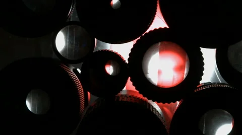 Many eyes of the lens. Multiple camera lenses with light from the back. Blackmag Stock Footage 64349571
