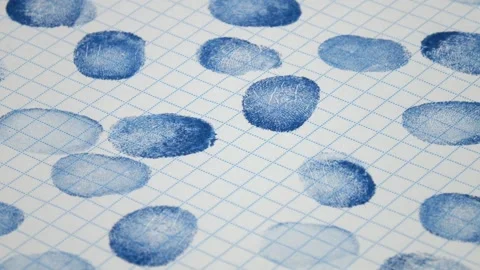 Many fingerprints on checkered paper, abstract background Stock Footage 336507707
