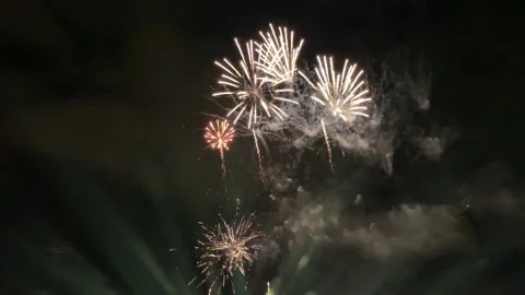Many fireworks explode in the night sky during a festival Stock Footage 230978335