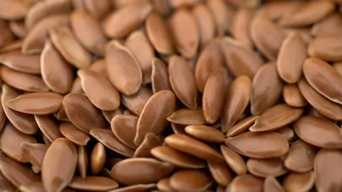 Many flax seeds rotating background Stock Footage 100401622