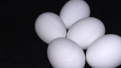Many fresh eggs doing rounds and rotating in circles Stock Footage 111274839