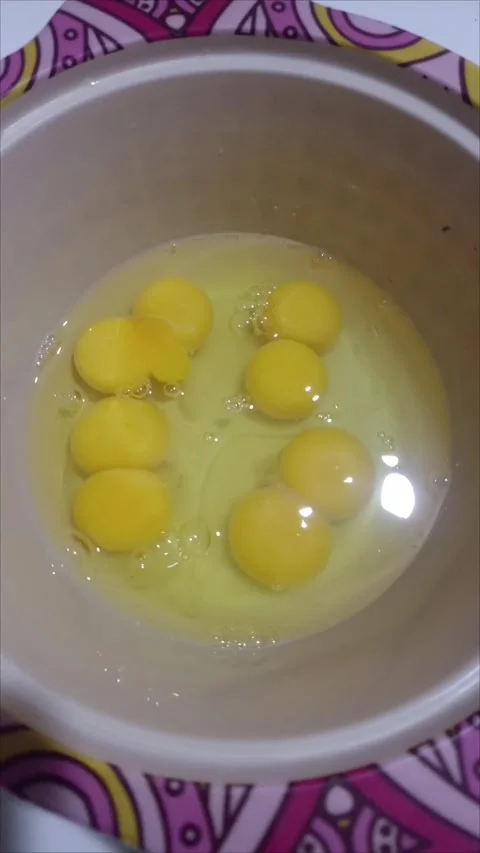 Many Fresh Raw Chicken Eggs Cracked in a Bowl Stock Footage 337799363