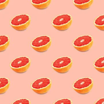 Many fresh ripe grapefruits on pink background. Seamless pattern design Stock Photos
