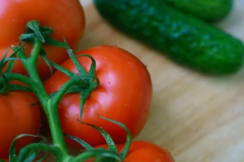 Many fresh ripe tomatoes close up shot Stock Photos