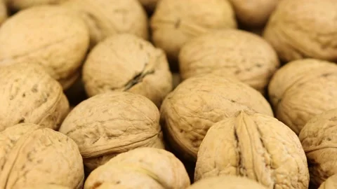 Many fresh walnuts rotating around Stock Footage 219212698