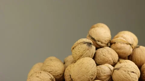 Many fresh walnuts rotating around Stock Footage 219212887