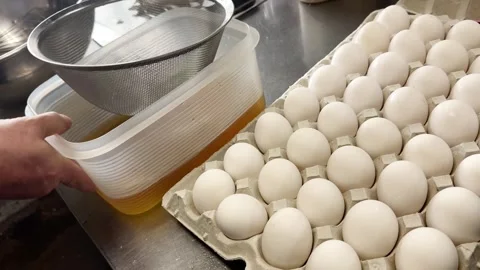 Many Fresh White Eggs in Trays and Broth for Dashimaki Omelette, Japanese Food Stock Footage 340751841