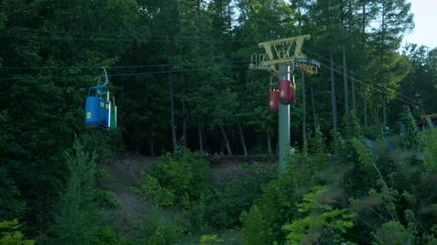 Many funiculars blue red and green ride dow Stock Footage 158447198