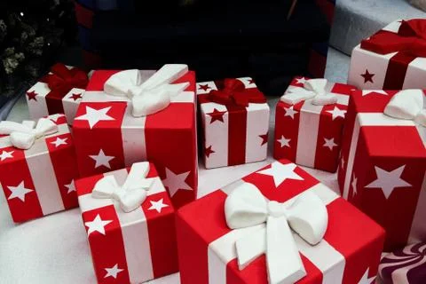 Many gift boxes are red with white stars. Gifts for any occasion. Red-white Stock Photos