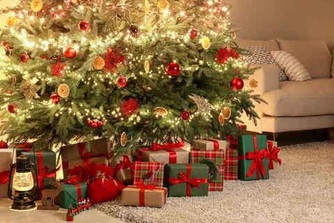 Many gift boxes, decorative elements and Christmas tree at home 스톡 사진