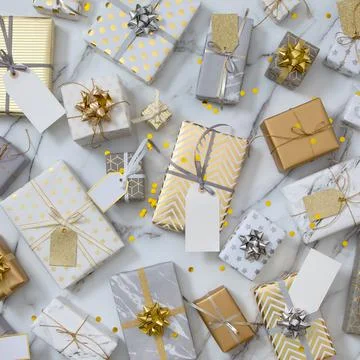 Many gift boxes with labels numbers wrapped in glossy classical pack ready for Stock Photos
