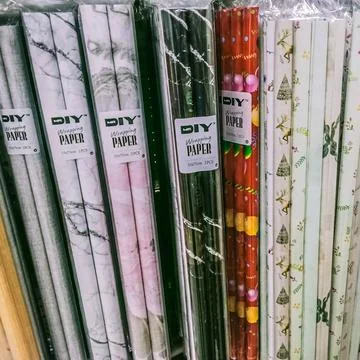 Many gift wrapping papers Stock Photos