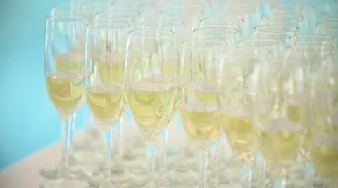 Many glasses of champagne on the table Stock Footage 64576732