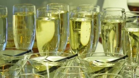 Many glasses of champagne on the table Stock Footage 77032737