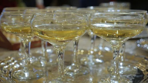 Many glasses of champagne on the table Stock Footage 85549544