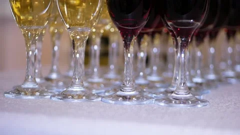 Many glasses of champagne on the table Stock Footage 127621064