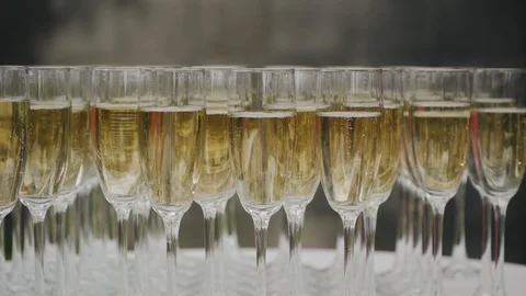 Many glasses of champagne on the table stand Stock Footage 101685312