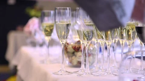 Many glasses of wine are on the table with wine bottle Stock Footage 52815584