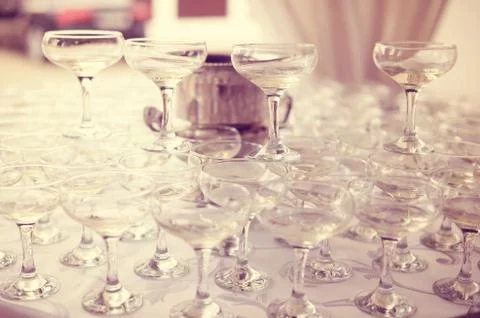 Many glasses of wine on table Stock Photos