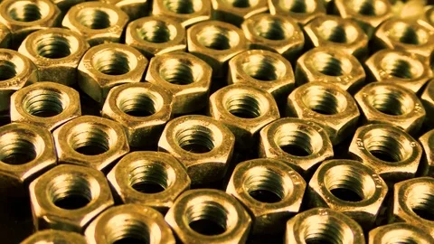 Many gold hexagonal screws, abstract background Stock Footage 83264824