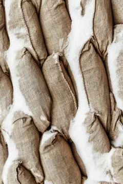 Many gray sandbag. Pattern closeup vertical background protection military Stock Photos