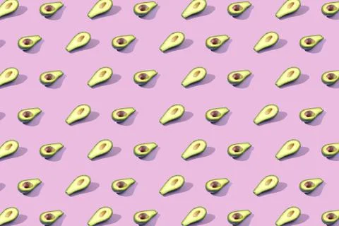 Many halves of avocado, pattern, banner. Billet bright background, pink purpl Stock Photos