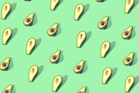 Many halves of avocado, pattern, banner. Preparation of a bright background,  Stock Photos