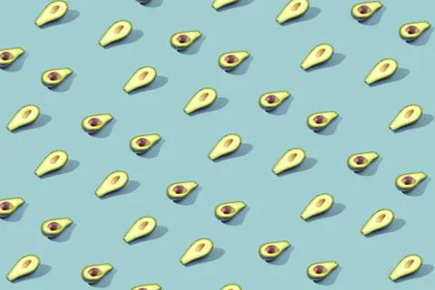 Many halves of avocado, pattern, banner. Blank bright background, blue purple Stock Photos