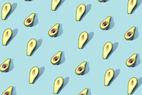 Many halves of avocado, pattern, banner. Blank bright background, blue purple Stock Photos