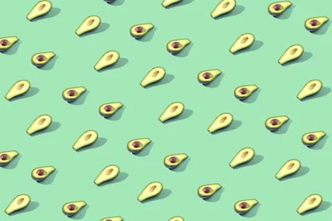 Many halves of avocado, pattern, banner. Preparation of a bright background,  Stock Photos