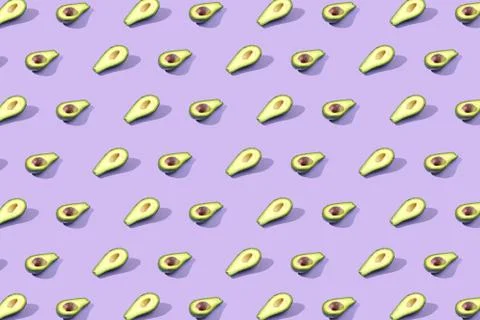 Many halves of avocado, pattern, banner. Billet bright background, pink purpl Stock Photos
