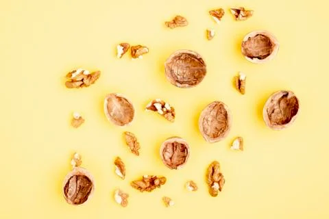 Many halves of walnut on blue background Stock Photos