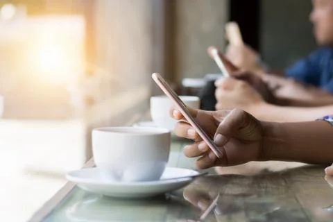Many hand using smartphone in coffee shop Stock Photos