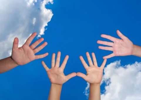 Many hands on blue sky background Stock-Fotos