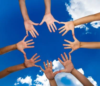 Many hands on blue sky background Stock Photos