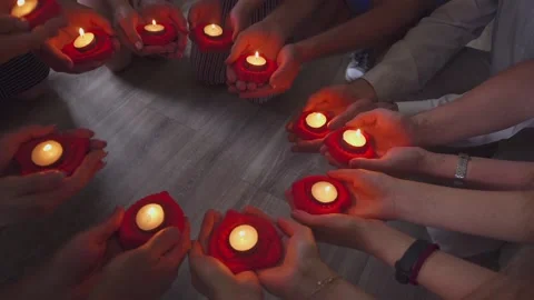 Many hands with candles hd Stock Footage 142511445