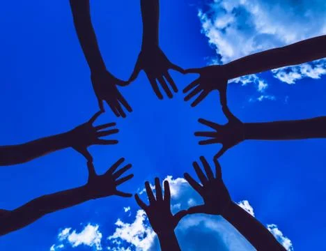 Many hands on the dark sky background Stock Photos