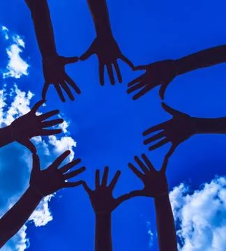 Many hands on the dark sky background Stock Photos