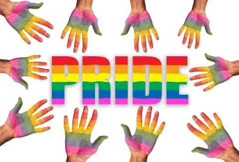 Many hands painted in rainbow flag colors reaching out for the word Pride Stock Photos