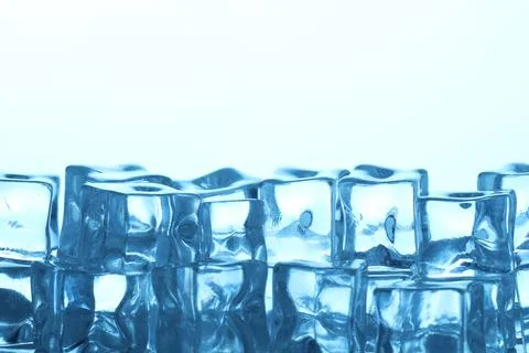 Many ice cubes on light background, closeup. Space for text Stock Photos