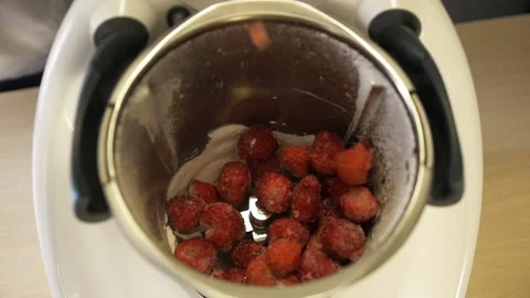 Many ice fruit strawberries fall blender slow motion for mixing blender closeup. Stock Footage 159929867