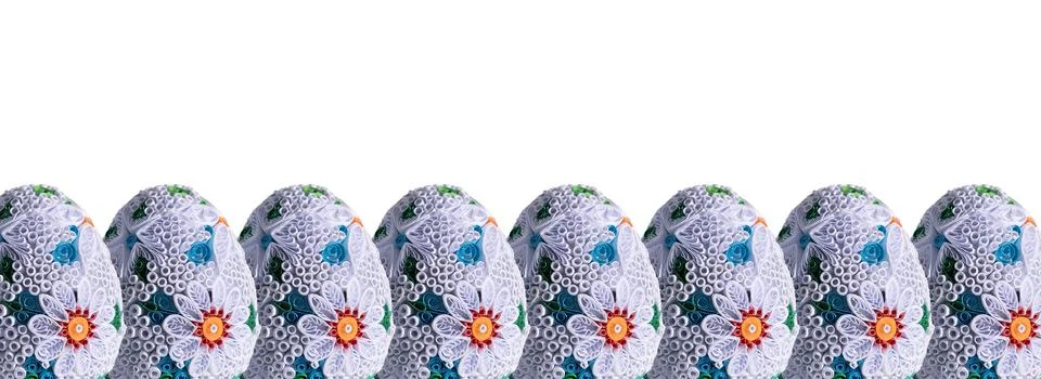 Many identical Easter eggs arranged at the bottom of the photo into a single 写真素材